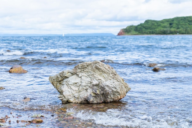 One large stone lying on the seashore