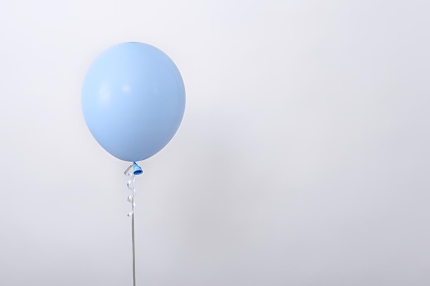 One minimal blue balloon on white background copy space element of decorations for birthday party wedding festival template