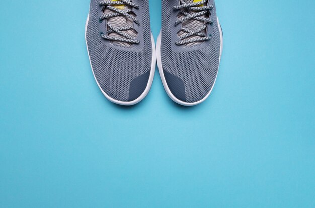 One Pair of blue sport shoes on blue background