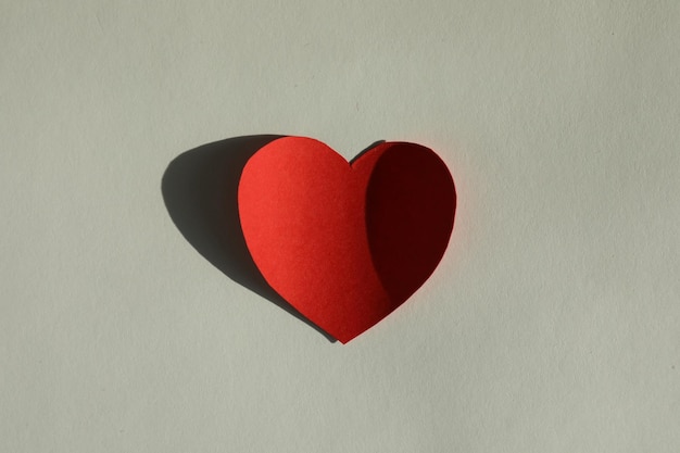 Photo one paper heart on grey background top view