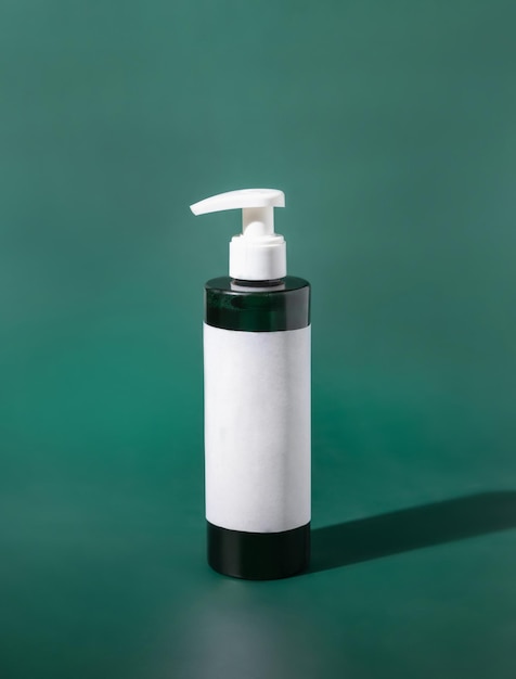 One pump Plastic bottle with blank label on green Cosmetic packaging Mockup