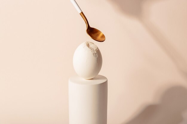 One white egg on a podium. minimalism and simplicity aesthetics