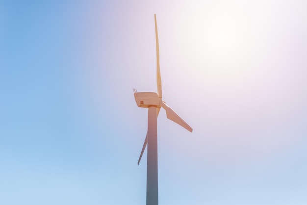 One wind power turbine and sunblue skywind power concept with copy space