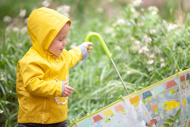 One year old boy playing with an umbrella