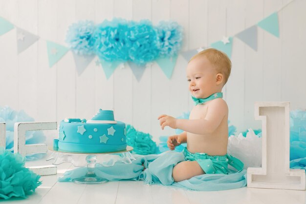 A oneyearold boy tries his first birthday cake Anniversary Party