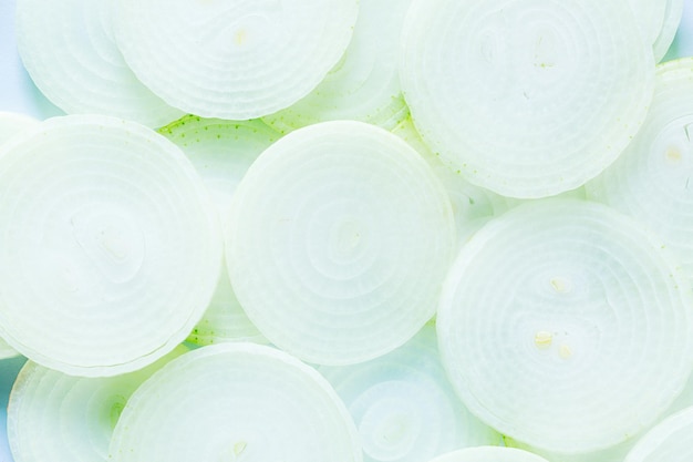 onion macro,Colorful green and yellow leek slices. onion macro,Sliced pink onion. Slices. Pattern.