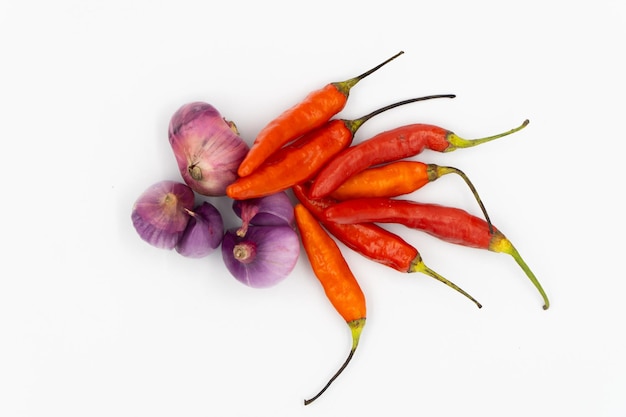 Onion vegetables and cayenne pepper on a white background