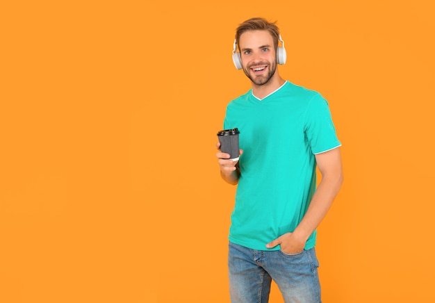 Online education back to school young guy in headphones drink coffee music lover