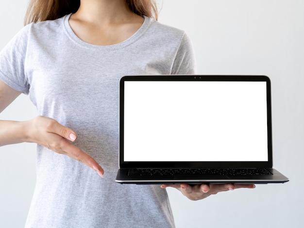 Online education digital technology advertising mockup unrecognizable woman pointing to laptop in