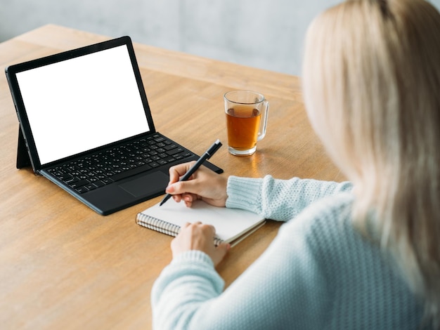 Online education writing woman computer mockup unrecognizable lady studying laptop blank screen