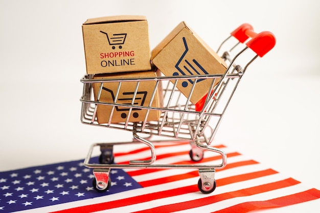 Online shopping Shopping cart box on USA America flag import export finance commerce