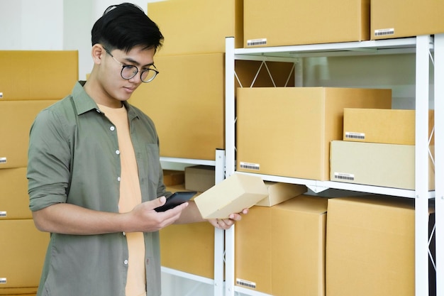 Online store owner checking orders for packaged product