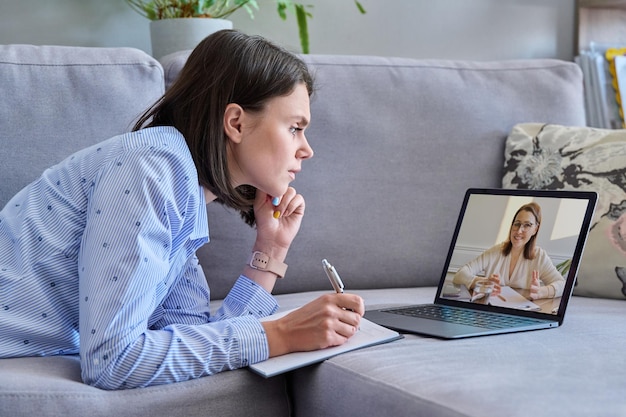 Online therapy meeting of young woman with psychologist