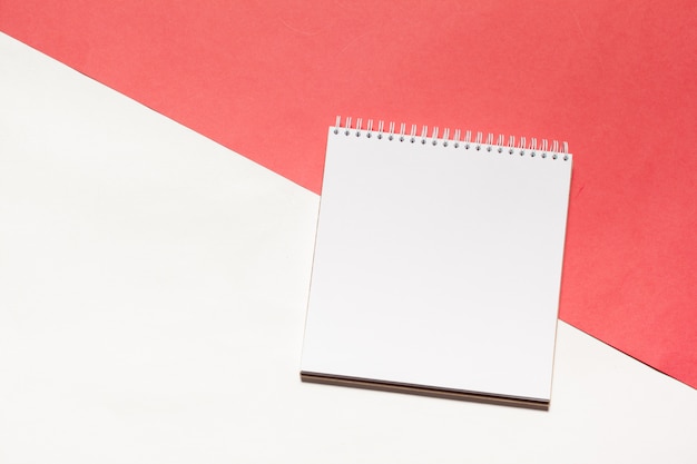 Open blank notebook on colorful background