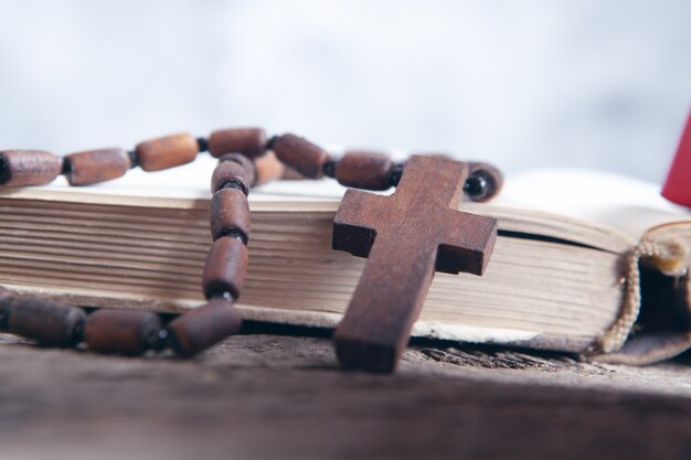 Open book and cross on the table