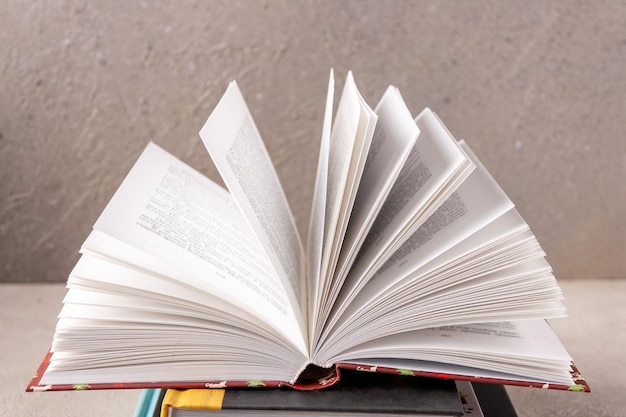 Open book on a gray background closeup