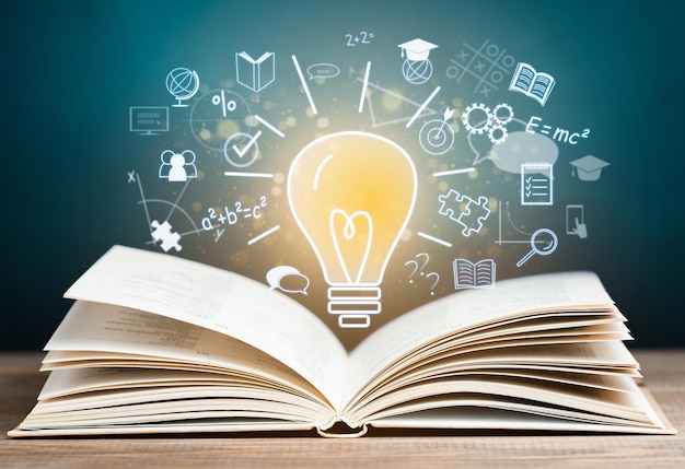 Open book and holographic light bulb with education icons concept of learning