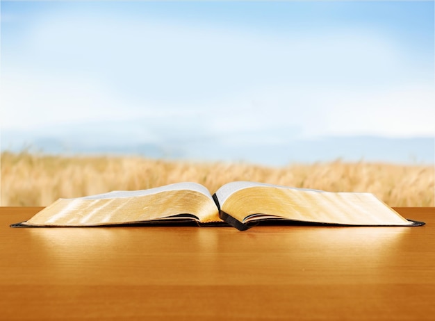 Open book on table isolated on  background