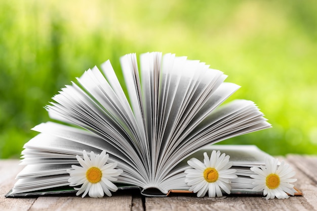 Open book with flowers closeup