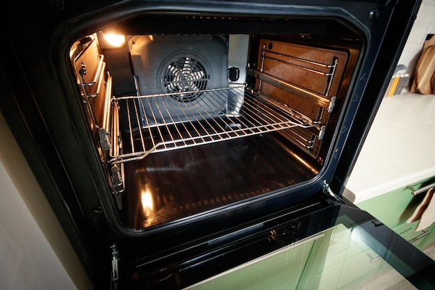 Open builtin oven with lighting in the home kitchen