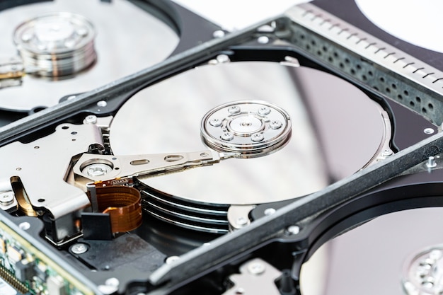 Open hard disk drives close up. Information, data storage infrastructure cost concept