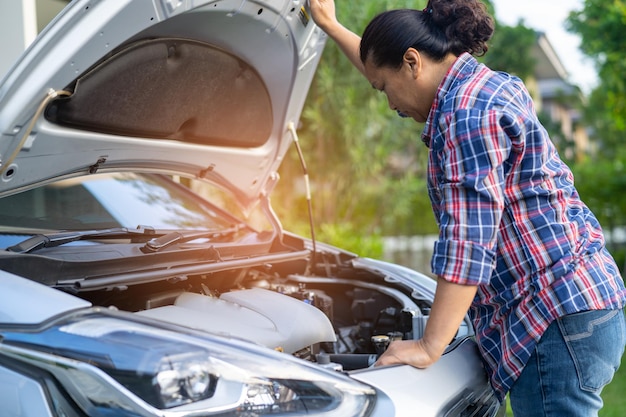 Open hood mechanic engine system to check and repair damage car crash