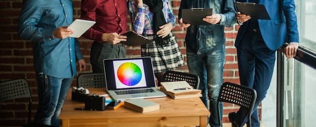 open laptop computer with a color palette in workplace designer