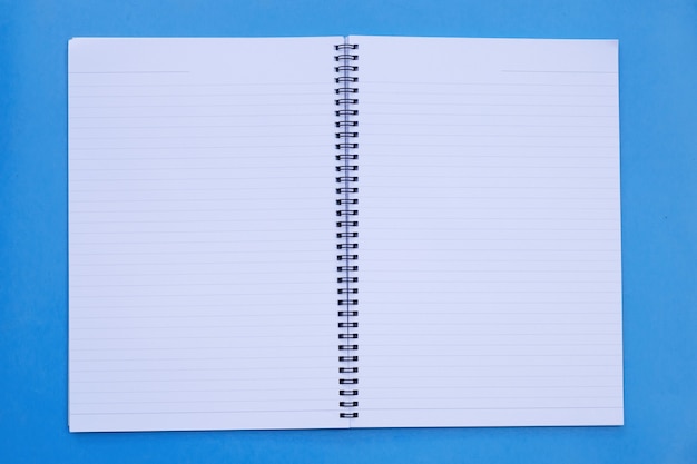 Open notebook on blue