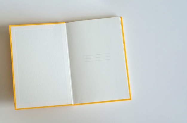 Open notebook with blank pages on white background