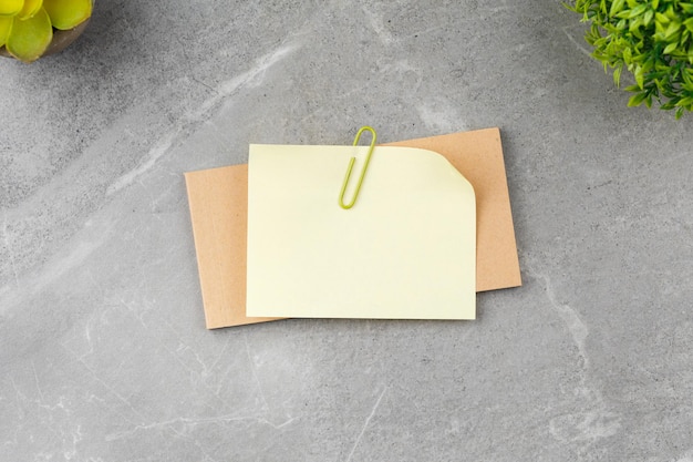 Open notepad on gray marble background