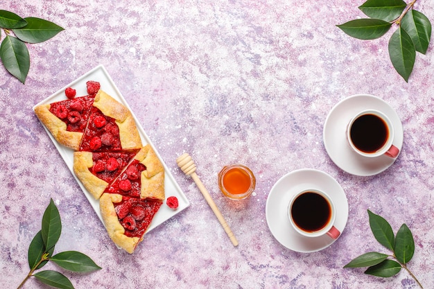 Open pie, raspberry galette. Summer berry dessert.