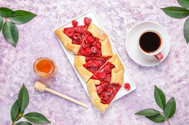 Open pie, raspberry galette. Summer berry dessert.