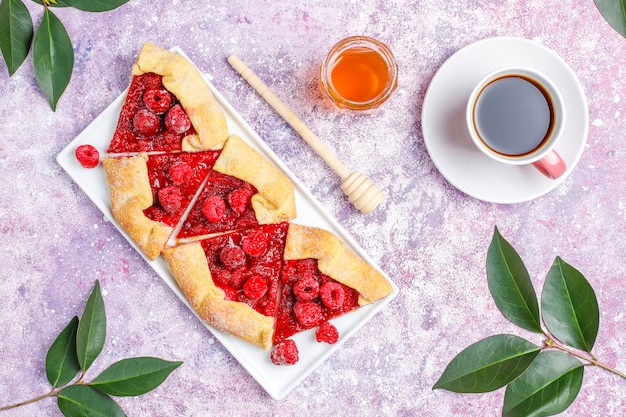 Open pie, raspberry galette. Summer berry dessert.