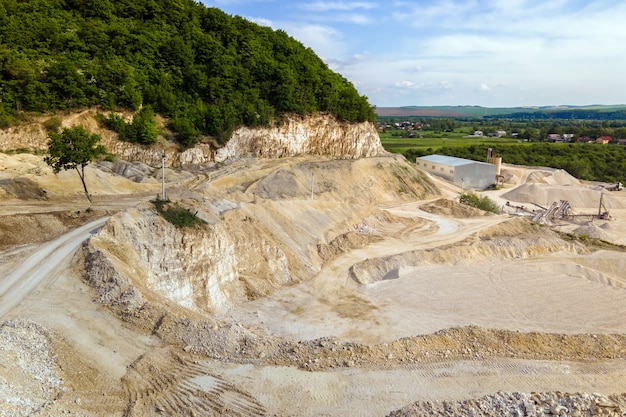 Open pit mining of construction sand stone materials.