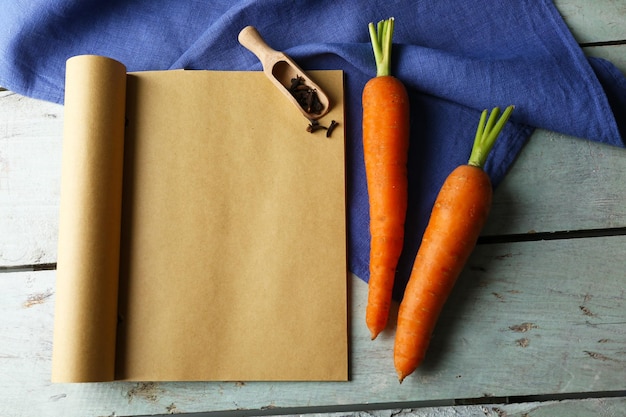 Open recipe book on wooden background