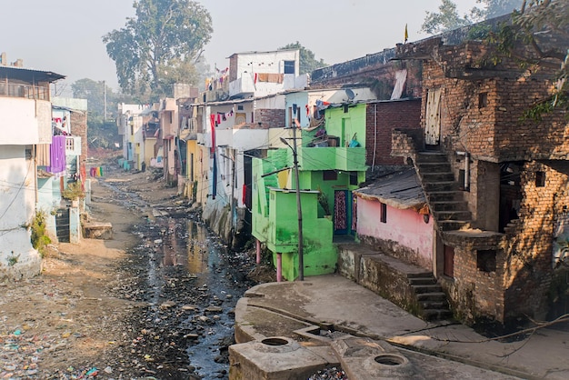 Open sewer as a fetid river flows between houses