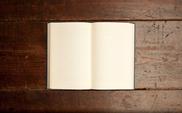 open vintage book on vintage wooden table