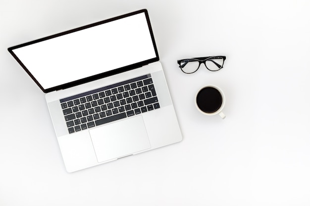 Opened laptop with isolated screen on white desk