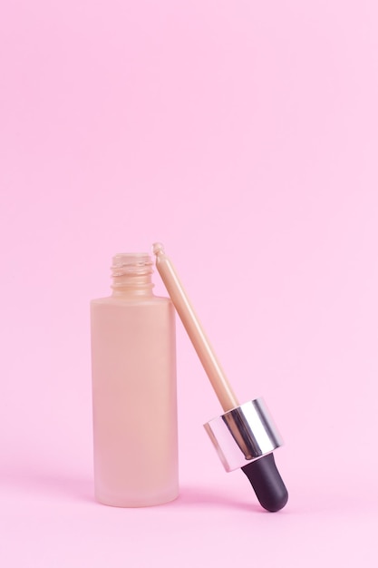 Opened liquid foundation cream with pipette unbranded bottle BB cream for professional makeup