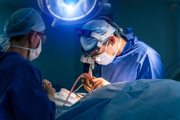 Operating Room With Surgery In Progress Medical team performing surgical operation in bright modern operating room