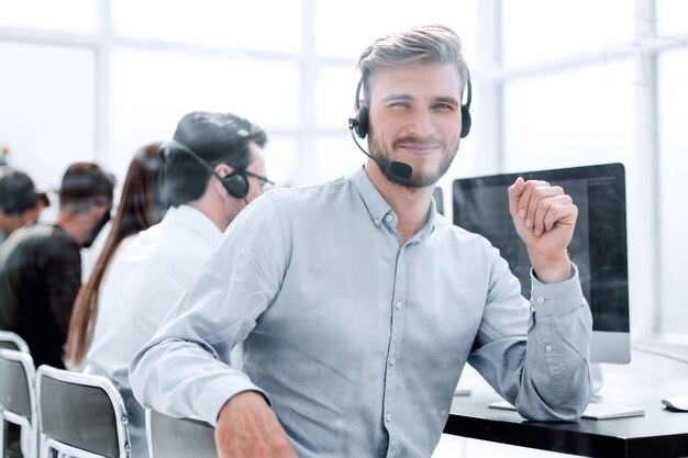 Operator call center in the workplace in a bright office photo with copy space