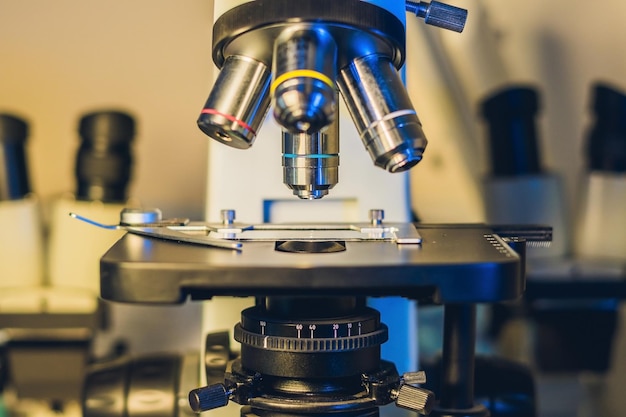 Optical microscope with four different objective lenses.