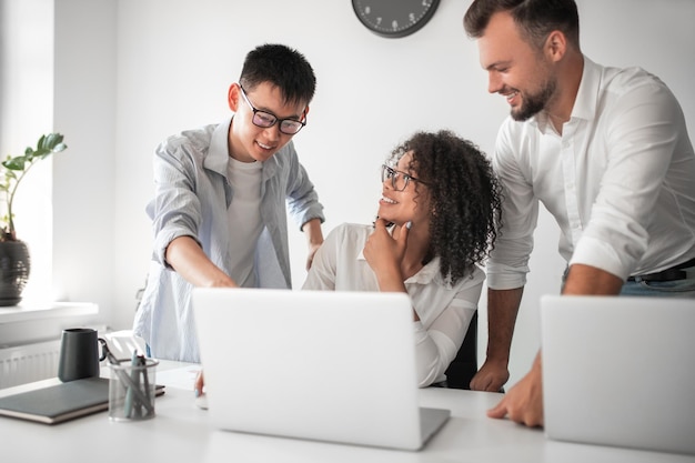 Optimistic coworkers discussing project together