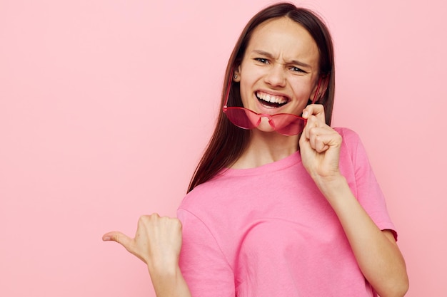 Optimistic young woman in stylish glasses posing emotions lifestyle unaltered