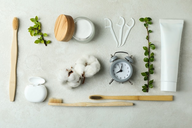 Oral care accessories on white textured background