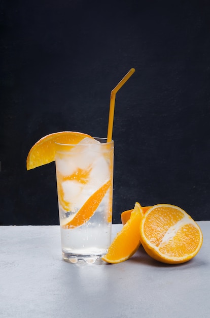 Orange alcohol cocktail with orange fruit slice