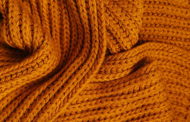 Orange autumn knitting wool texture background.