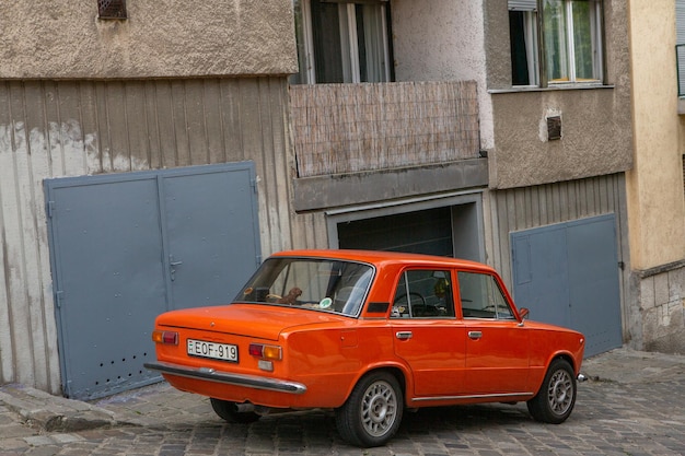 Photo an orange car with the license plate number plate n p