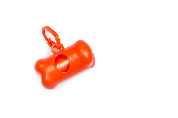 Orange dog poop bag holder on a white background with copy space