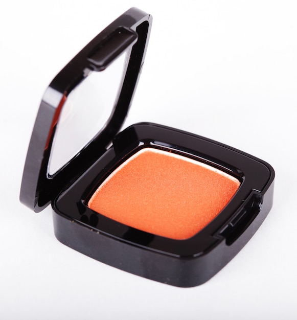 Orange eye shadows on white background